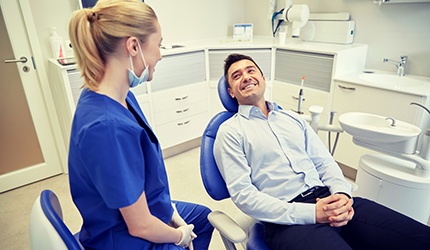 man smiling at his dentist