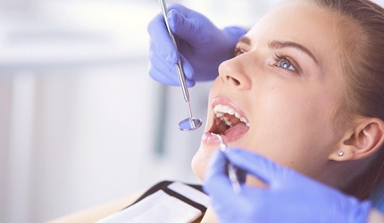 Woman receiving dental checkup