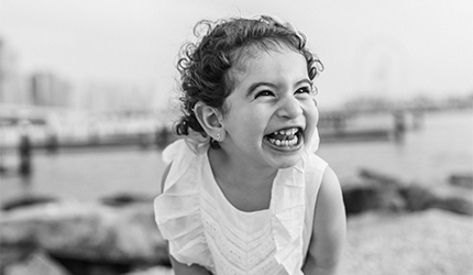 A young child smiling