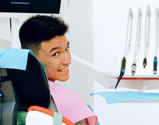 Man in dental chair smiling