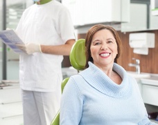 Woman in dental chair smiling