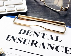 Dental insurance paperwork lying on table