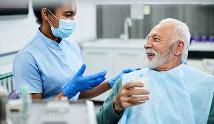 patient asking questions about dentures in DeSoto 