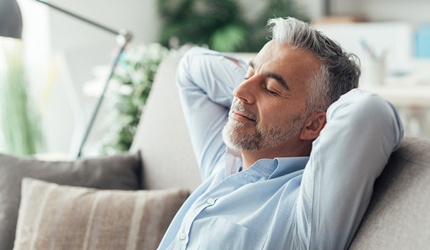 Man resting after receiving tooth extraction in DeSoto