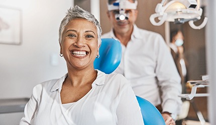 Closeup of patient smiling in treatment chair