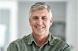 Older man wearing green shirt