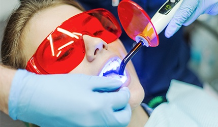 Patient receiving dental sealants