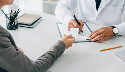 Patient talking with dentist about alternative payment options 