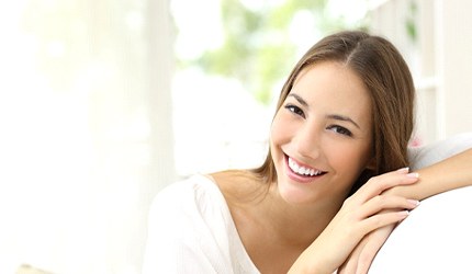 Smiling woman with porcelain veneers in DeSoto