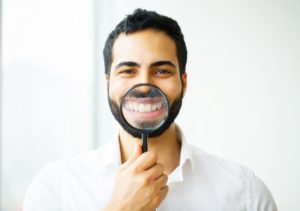 man smiling after seeing cosmetic dentist in DeSoto 