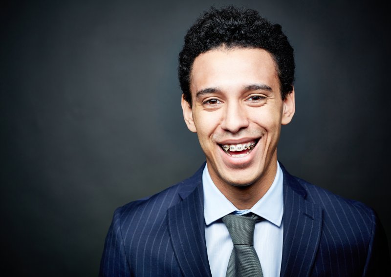 A businessman wearing braces to work