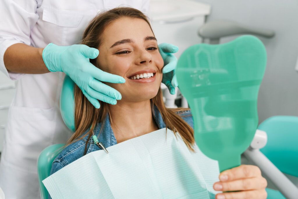 A woman at the dentist getting a smile makeover